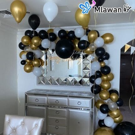 Black, gold, and white helium balloons for birthday decoration