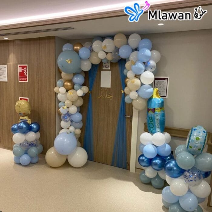 Large balloon arch for baby boy room decor in Abu Dhabi