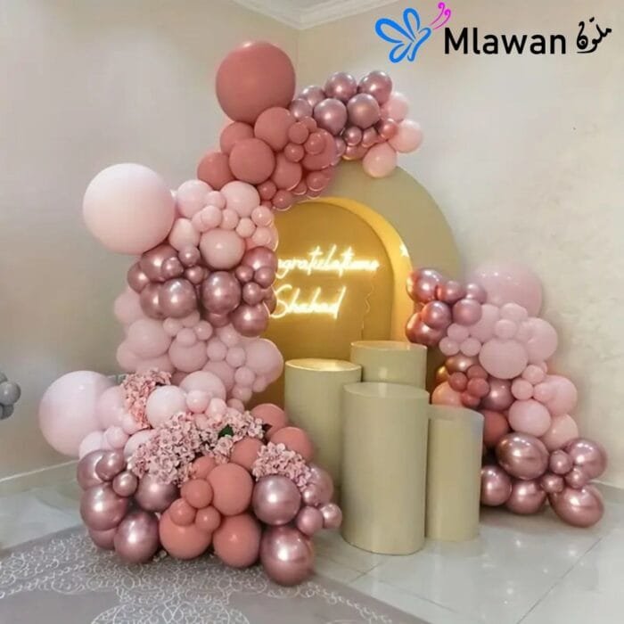 luxury dark light pink balloon installation newborn hospital room Dubai