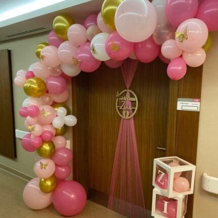 Personalized baby welcome sign with balloon arch in UAE hospital