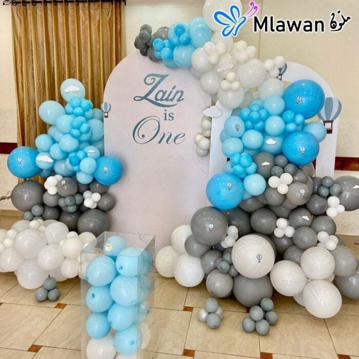 Custom balloon setup with photo backdrop for birthday event