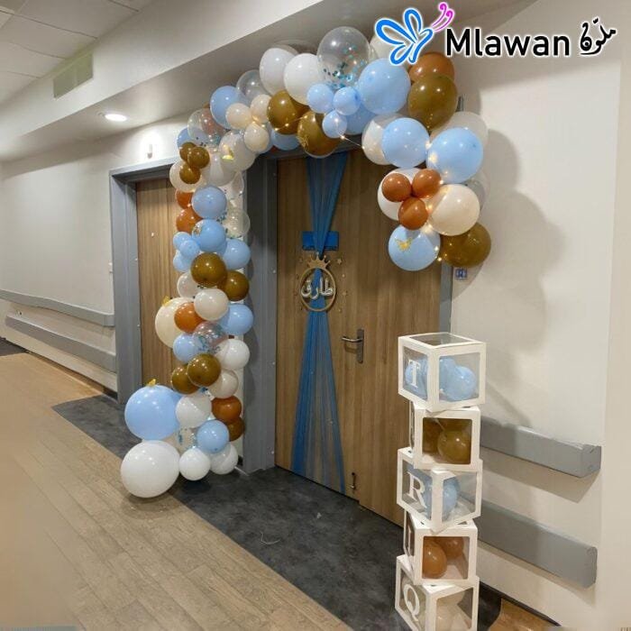 Personalized baby name box and balloon arch for newborn arrival