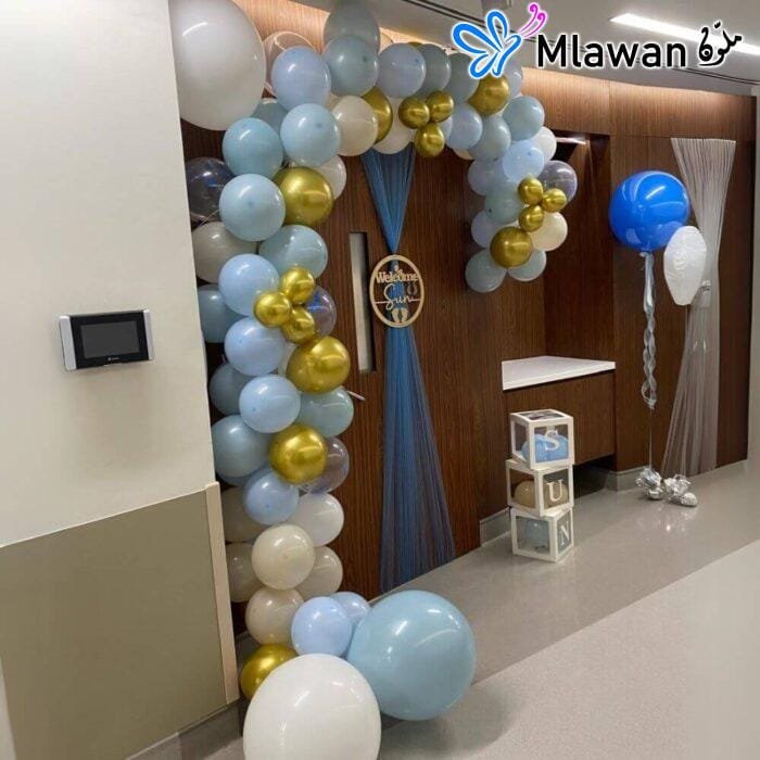 Balloon arch and door décor setup for baby welcome at Mediclinic