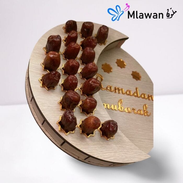 Wooden tray shaped like a crescent moon, perfect for serving dates or other food.