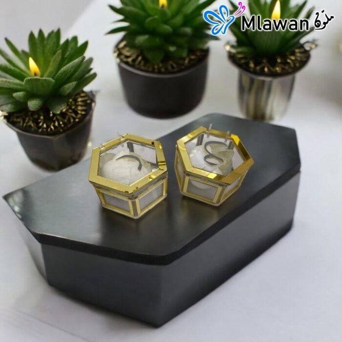 Stylish clear acrylic ring box with hexagonal shape and gold trim